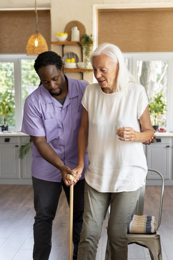 Stepping Forward Again male social worker taking care old woman