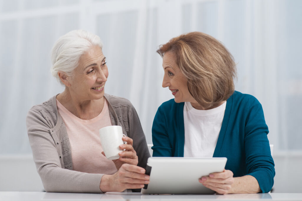 senior women smiling each other